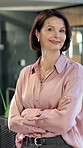 Face, business and woman in office with smile, career pride and real estate agent for about us. Portrait, mature person or happy in workplace with arms crossed, realtor consultant and property resale