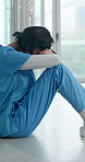 Woman, upset and nurse with stress in hospital for bad news or negative patient results. Migraine, fatigue and healthcare worker with mental health for mistake, error or medical fail in clinic.