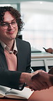 Handshake, people and notebook in office for recruitment, interview and human resources agreement. Candidate, shaking hands and hiring with job offer, opportunity and document for onboarding process