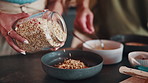 Hands, woman and cooking in kitchen for breakfast, healthy food and oats nutrition for digestion. Couple, granola or cereal at house for meal prep, dietary fibre and organic antioxidants for wellness