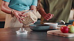 Hands, couple and cooking in kitchen for breakfast, healthy food and oats nutrition for digestion. People, granola or fruits at house for meal prep, dietary fibre and antioxidants cereal for wellness