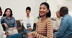 Counseling, smile and woman in support group for therapy, rehabilitation circle and healing session. Office, face and happy person in psychology meeting for recovery, laugh and mental health wellness