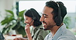 Call center, happy man and coworking with conversation in office for telecom, sales and consulting. Explain, advice and male agent laughing with headset for telemarketing, lead generation and CRM