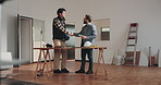 Men, handshake and meeting with interior designer in house, talk or planning for remodeling project. Design, agreement and happy people with color palette, shaking hands and ideas for home renovation