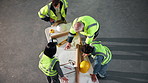 Above, engineer and team with document for construction, blueprint and sketch for architecture. People, talking and paperwork at site for floor plan, layout and collaboration for building development