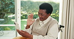 Black woman, wave and video call in home with phone, wheelchair and online communication on weekend. Happy, mature person with a disability and connection with tech, contact or virtual conversation
