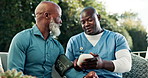 Nurse, checkup and old man at house for blood pressure, screening and vital signs of hypertension. Caregiver, monitor and senior person in backyard with device, assessment and track oxygen for health