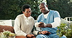 Nurse, machine and woman at house for blood pressure, screening and vital signs of hypertension. Caregiver, monitor and mature person in backyard with device, assessment and track oxygen for wellness