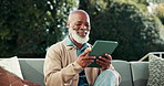 Senior, man and laugh in backyard with tablet, social media and reading funny news on weekend break. Happy, black person and pensioner scroll outdoor with digital tech, online meme and internet joke.