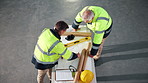 Architecture, above and men with blueprint in meeting for planning, renovation and building project. Collaboration, talking and people with drawing, floorplan or layout for construction or remodeling