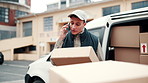 Angry, phone call and delivery man with box, outdoor and frustrated with wrong address or discussion. Unhappy, courier and person with mobile, communication and complaining about shipping mistake