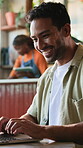 Freelancer, laughing and man with laptop in cafe, copywriter or plan for article publication on web. Copywriting, online and happy person with technology, remote work and typing blog post in shop