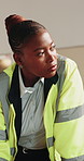 Black woman, engineer and writing on document for construction, blueprint and architecture. Thinking, person and drawing at site with paperwork, floor plan and layout sketch for building design