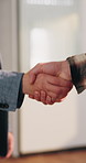 Blueprint, welcome and construction team with handshake in office for building agreement or approval. Floor plan, deal and civil engineer shaking hands with foreman for renovation contract on site.