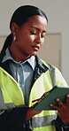 Inspection, engineer and tablet with woman in building for construction site, planning and renovation. Reading, architect supervisor and contractor with person for remodeling project and tech