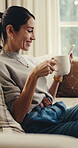 Laughing, phone and woman on couch with coffee, online communication and comic post on social media. Happy, digital and mature person in house with warm drink, funny text or meme reaction on chat app
