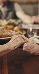Prayer, holding hands and lunch with family in dining room of house for grace, food and nutrition. Support, worship and people eating at home for thanksgiving holiday, religion and spiritual event
