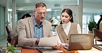 Review, paper or people in office with laptop, expense analysis or guidance on funding pitch. Coworking, manager or finance analyst with document, budget control or feedback on investment proposal.