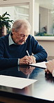 Senior, man and contract with signature for legal agreement, policy or retirement plan in office. Elderly, male person or pensioner signing with documents or paperwork for insurance or title deed