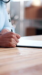Person, hands and paperwork in office with signature, legal agreement and official contract. Notary, writing and document in law firm for authentication, authorization and consent with pen on forms