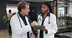 People, doctors and talk at hospital with tablet, research and medical report for diagnosis opinion. Team, chat and review in workplace with digital, patient history and healthcare case for treatment