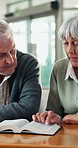 Senior, couple and reading with book for knowledge, literature or story in retirement home. Elderly, man and woman studying information with novel for wisdom, history or scripture in old age house