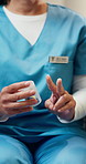 Hands, caregiver and container at house with pills, prescription and advice for medical dosage. Person, nurse and supplements reminder in home of medicine, instructions and daily intake for treatment