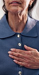 Hands, old woman and chest at house with discomfort, lung disease and symptoms of asthma. Unwell, senior person and airway irritation in home with viral infection, bronchitis and breathing difficulty