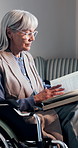 Bible, praise and senior woman in wheelchair for religion, worship or spiritual wellness in bedroom. Glasses, reading and elderly person with disability studying holy scripture for guidance in home.