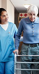Nurse, old woman and help with walker for physiotherapy, healthcare and rehabilitation support. Medical worker, frame and person with disability, retirement and talking for physical therapy in clinic