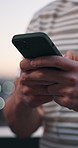 Phone, typing and hands of businessman in city with texting, email or communication for UX design. Technology, contact and software engineer with cellphone for review on web development in town.