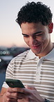 Happy, typing and businessman with phone in city with texting, email or communication for UX design. Technology, contact and software engineer with cellphone for review on web development in town.