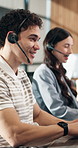 Telemarketer, typing and man with headset in call center, discussion and communication with contact. Telemarketing, lead generation and happy person with mic, coworking and consultation with tech