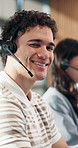 Consultant, face and happy man with headset in call center, laughing and communication with contact. Coworking, agent and person with mic, lead generation and telemarketing with smile in business