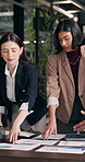Meeting, chart and business women with documents for finance review, investment or budget planning. Office, talking and people with graph, paperwork or research for financial report, profit or growth