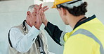 Construction, talking and people in building with high five for good job, renovation and compliance. Contractor, architecture and men with success for remodeling, progress and infrastructure project