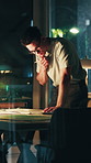 Architect, thinking and man with paperwork at night, sketch and drafting layout for design deadline. Architecture, drawing and mature person with ideas, working late and editing blueprint in office