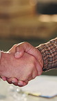 People, carpenter or meeting with handshake in warehouse for timber agreement or lumber project. Employees, colleagues or shaking hands with deal for carpentry business or wood production in workshop