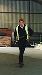 Excited, carpenter and dance in warehouse with success, clipboard and deal for woodwork procurement. Happy, man and groove in factory with checklist, celebration and milestone for carpentry business.