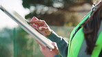 Outdoor, hands or engineer with tablet for planning, urban development or scroll on digital layout. Woman, bokeh or tech in nature for feedback, compliance research or project report for construction