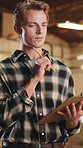Thinking, carpenter and man with clipboard in warehouse for inspection, planning or agenda. Manufacturing, timber factory and person with checklist for workshop, safety and compliance with stock