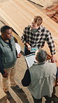Woodwork, teamwork and planning in factory above, stock inspection or production analysis. Men, carpenter and collaboration in meeting for manufacturing checklist, storage data and inventory tablet