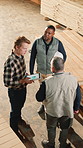 Carpenter, teamwork and planning in factory above, stock inspection or production analysis. Men, woodwork and collaboration in meeting for manufacturing, storage data and inventory with tablet