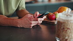 Typing, online and hands with phone in kitchen, networking or chat with contact on social media app. Digital, message and person with mobile, search and communication with internet connection in home