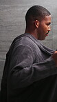 Bathrobe, mirror and undressing with black man in bathroom for morning routine, skincare and hygiene. Grooming, self care and beauty maintenance with person in home for cosmetology, check and glow
