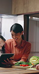 Cooking, happy and family with tablet in kitchen at house for bonding, connection or preparing meal. Digital technology, smile and Asian mom and dad with child for cutting vegetables for diet dinner.
