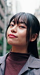 Tourist, face or Asian woman in town with pride, satisfaction or weekend unwind in outdoor travel. Portrait, smile or female person with confidence, urban break or holiday sightseeing on day off.