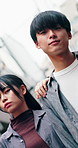 Face, fashion and vacation with Asian couple in city together for discovery or holiday exploration. Sightseeing, style and tourism with people outdoor in urban town for adventure, break or getaway