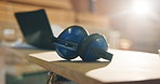Earmuffs, carpentry and workshop with safety tools, woodwork and noise reduction tech. Laptop, flare and equipment on desk with ppe, ear protection and hearing damage prevention in joinery industry