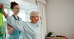 Physiotherapy, happy and senior woman with resistance band, physiotherapist and talking for advice. Exercise, healthcare and wellness with old patient at clinic for stretching, muscle and injury